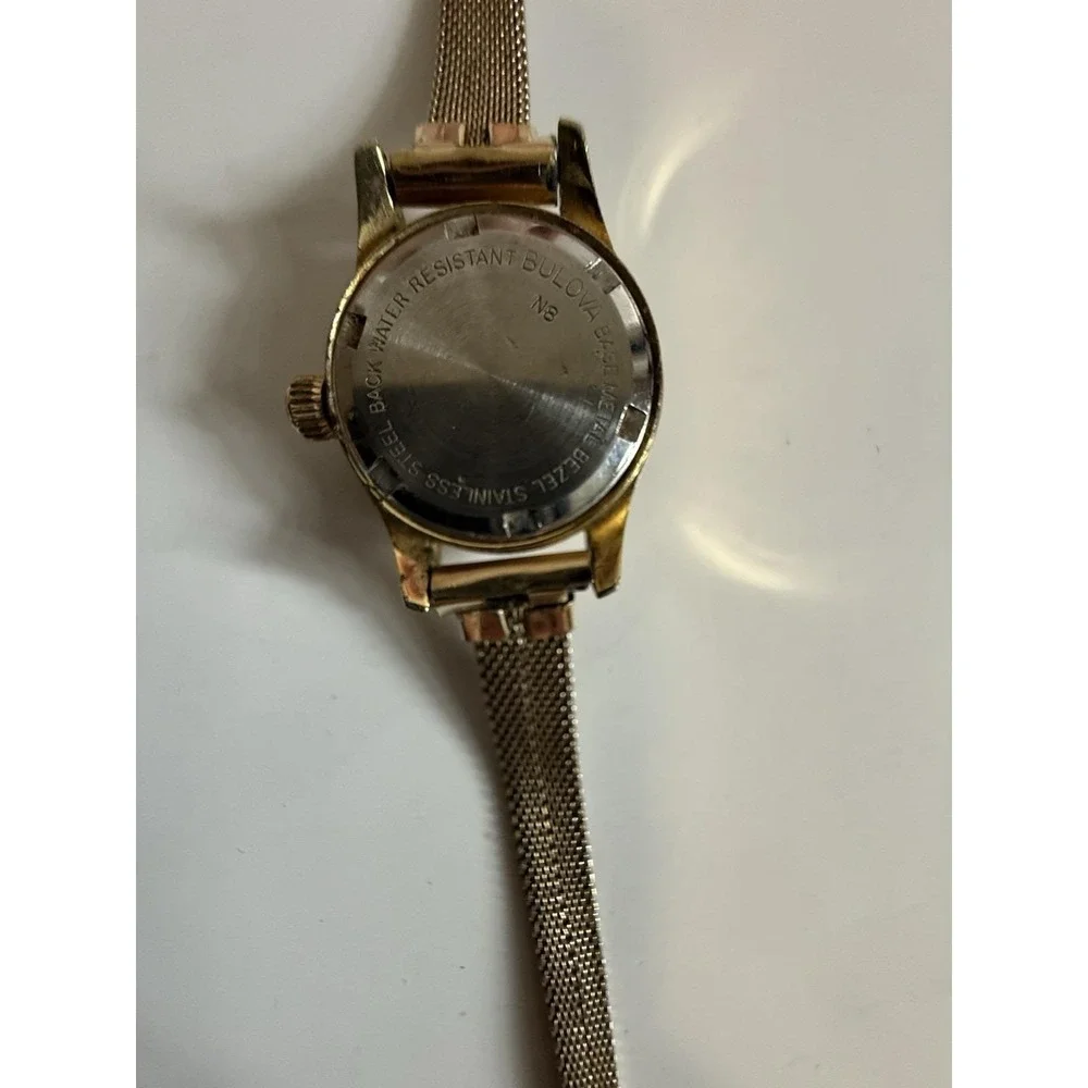 Vintage gold-tone women's mechanical watch by Bulova, manual-wind (mini model)